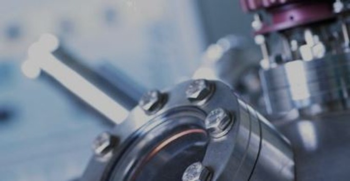 Close-up view of a machine valve, showcasing intricate details and mechanical components.