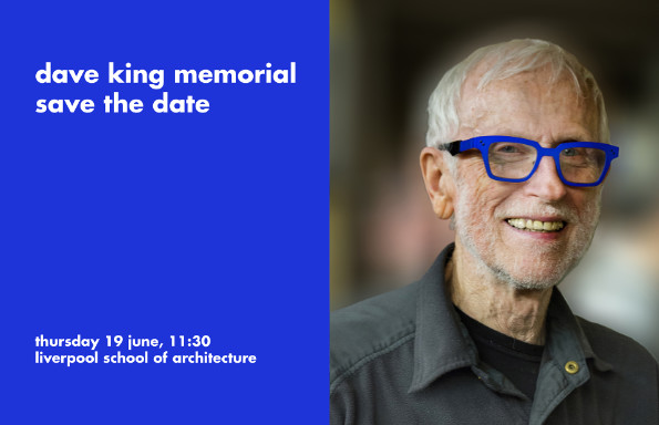 Smiling older man with short grey hair, wearing an open necked shirt and thick framed glasses. Text reads