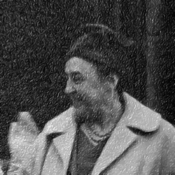 Photograph of a middle aged woman wearing heavy coat and brimless hat