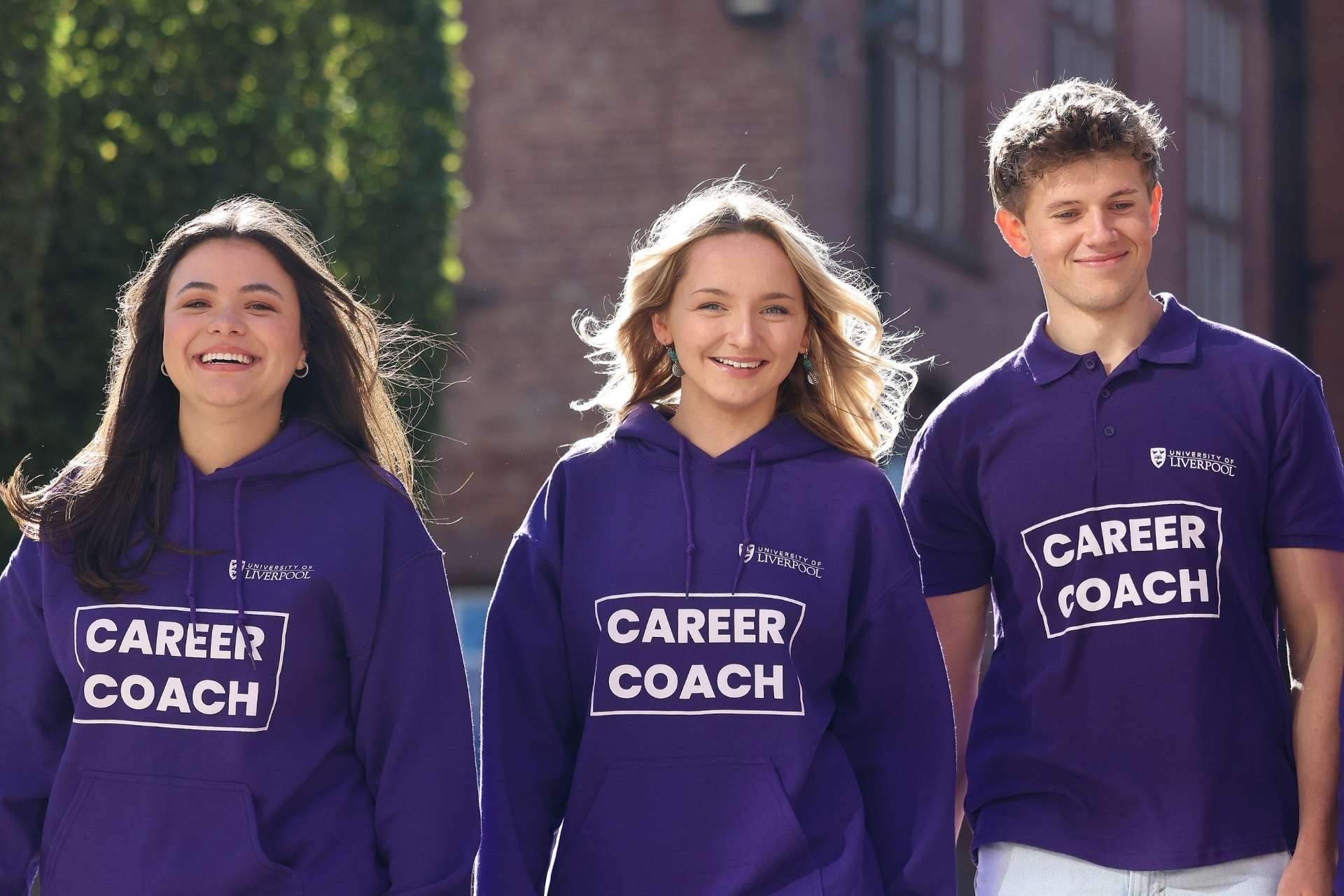 Career Coaches walking on campus laughing