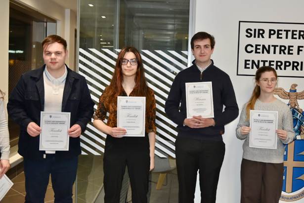 Students holding certificates