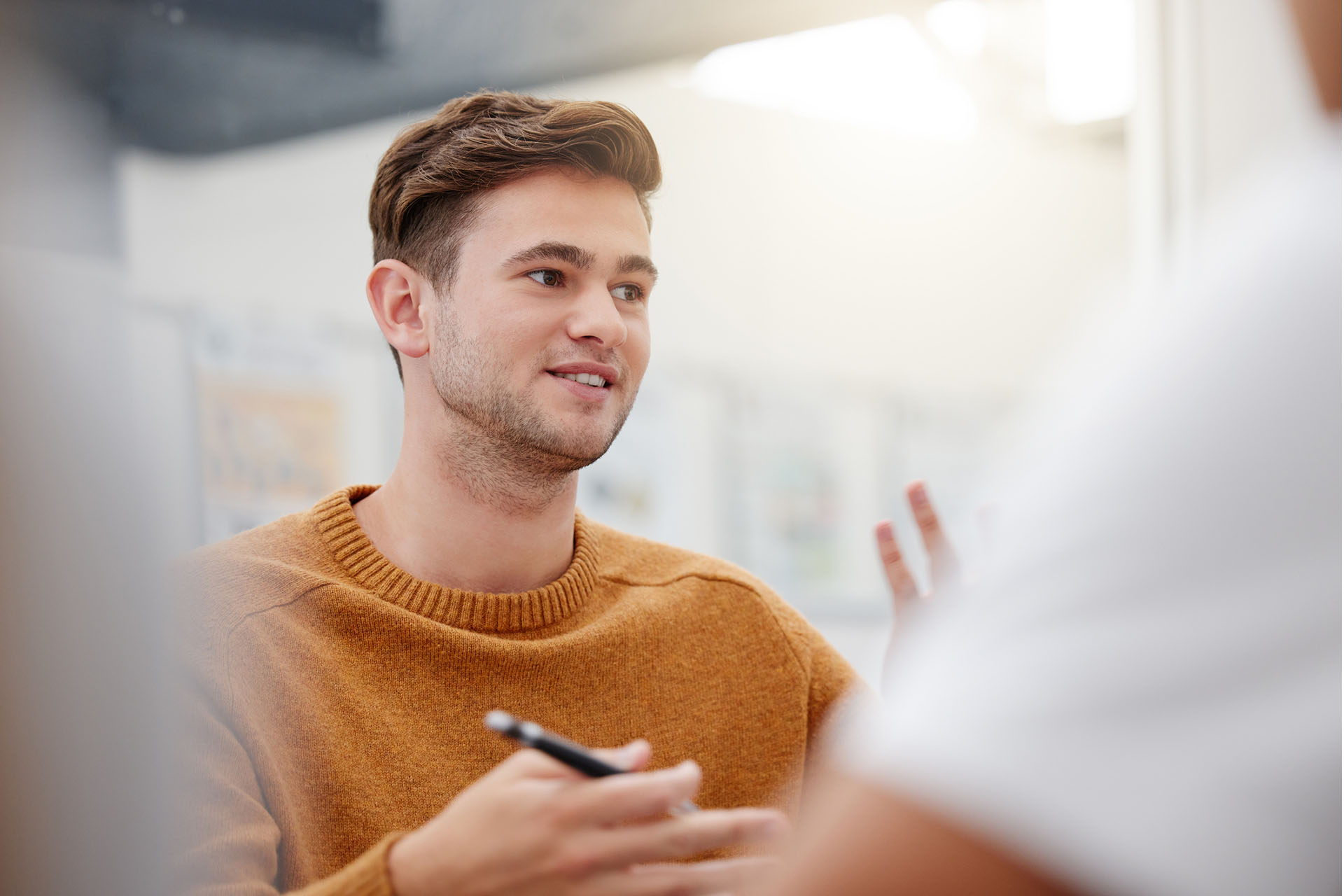 image of young man speaking to a doctor as part of a research study