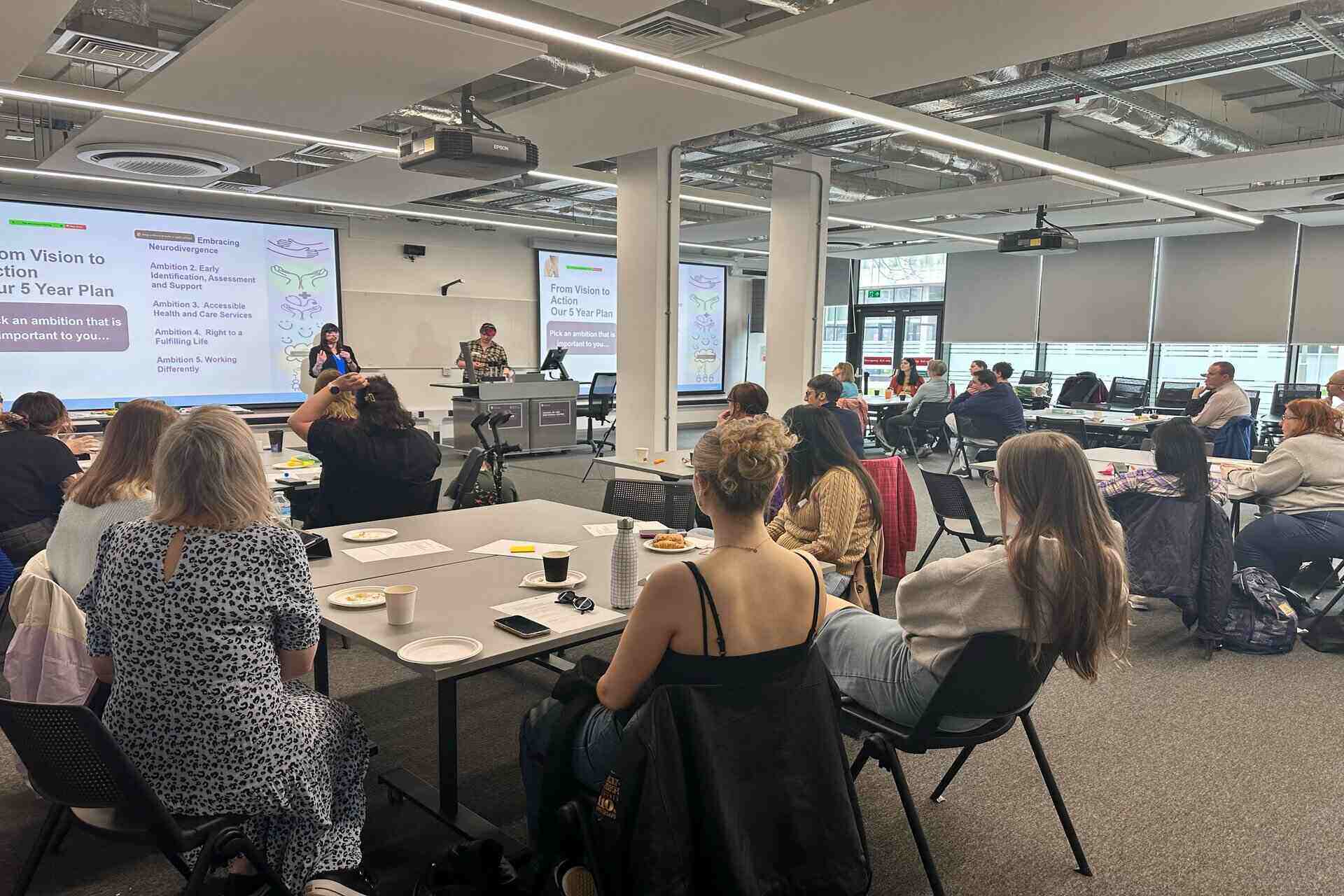 A photo of a room full of Autism Hub event attendees