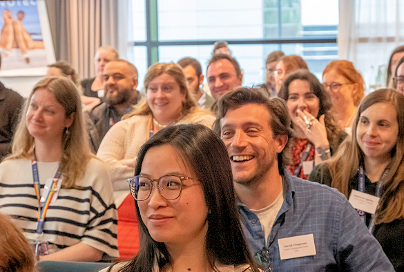 A photo of the showcase audience, several laughing