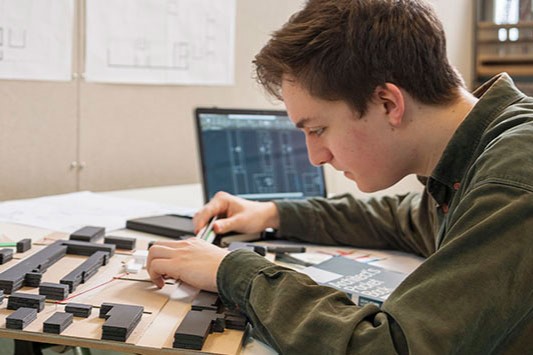 Student with architectural model
