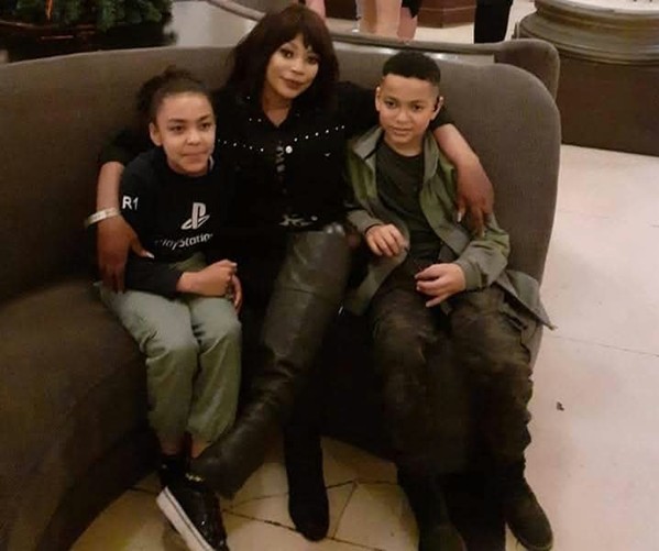 Mary Pollard, Go Higher alumni, with her children