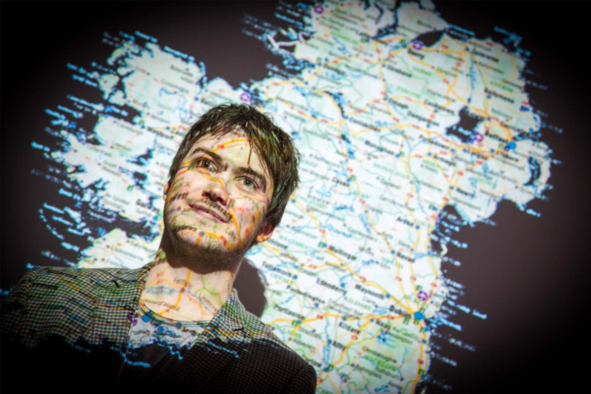 Irish map projected onto student