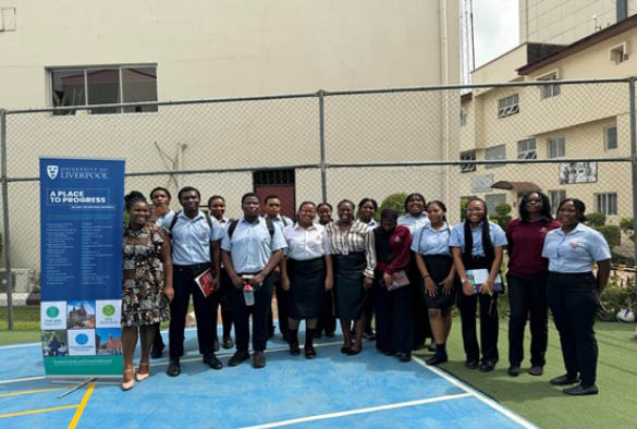 Group photo of students in a sports hall.
