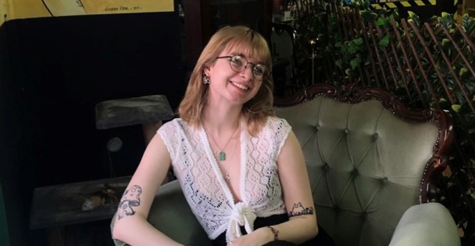Student Eva-Marie Deeley sat in a cafe