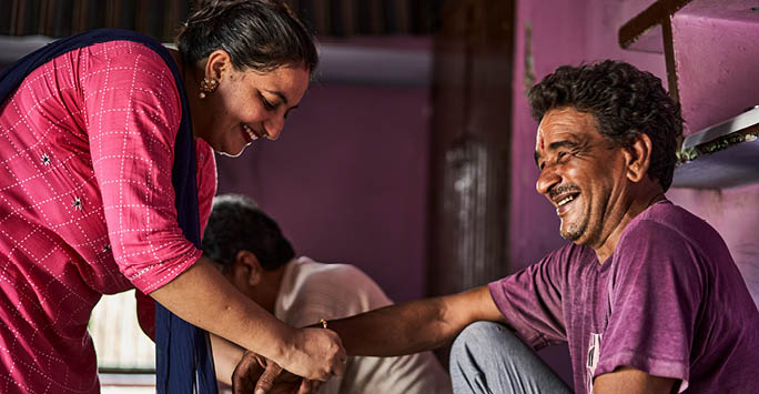 An indian family taking care of one another.