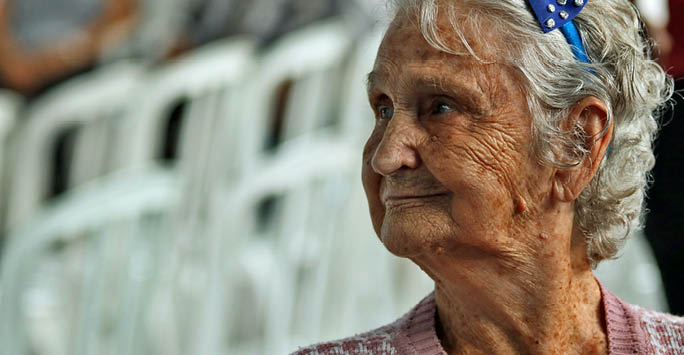 An older woman looking to the side.