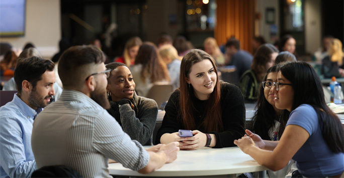 A group of students sat around a table together.