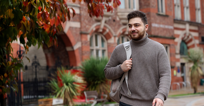 A student walks through campus.