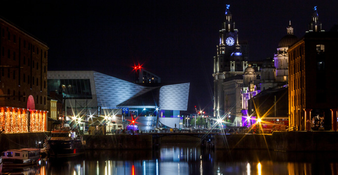 The Liverpool waterfront skyline at night.