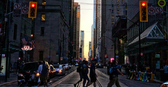 People crossing at the traffic lights.