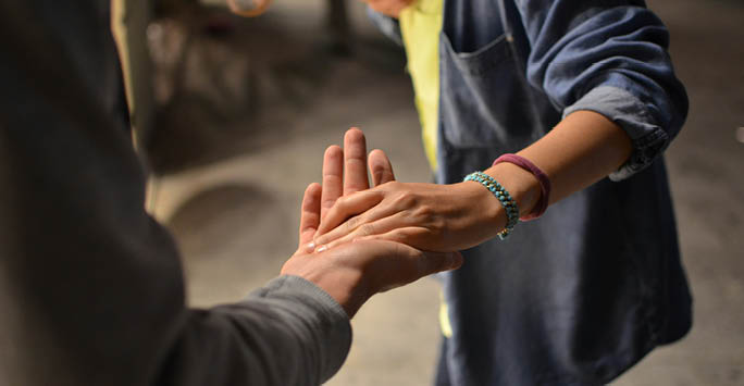 Two people shaking hands.