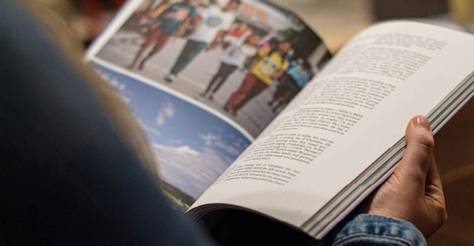 Someone reading a magazine.