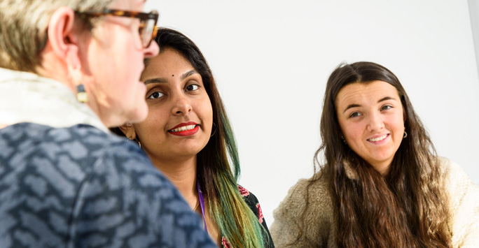 Students talking with a law clinic lecturer/solicitor