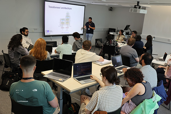 A person giving a presentation to students.