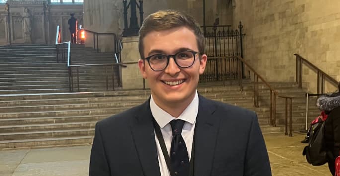 Alumni pupil, Caden, headshot inside a church