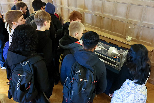 Students taking part in physics activities.