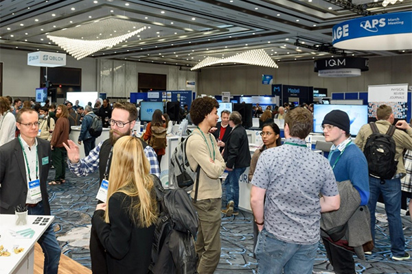 A group of people talking to each other.