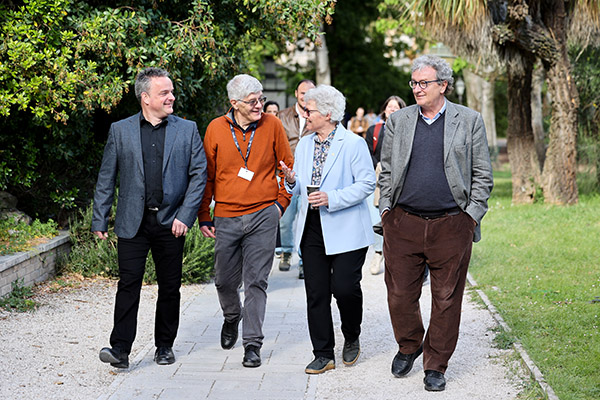 A picture of people walking in a park.