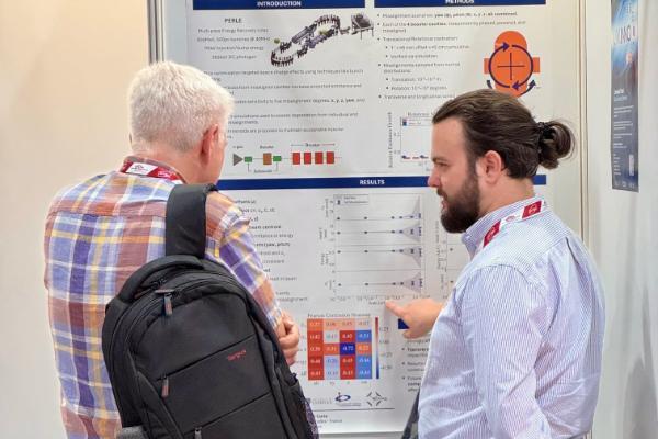 A person presenting a poster.