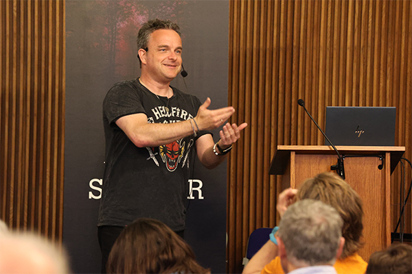 A presenter talking to the audience.