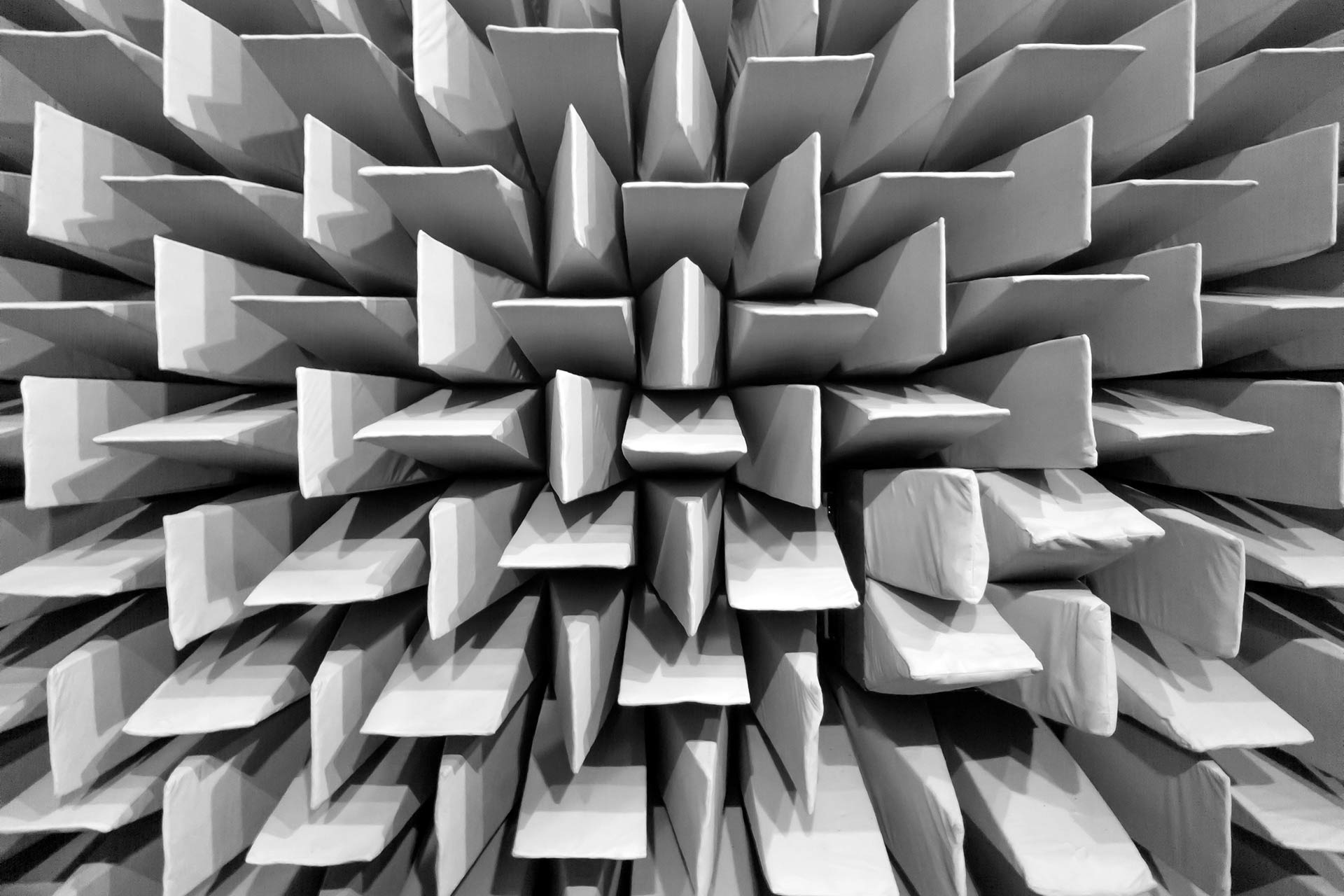 Anechoic chamber / dead room, acoustic absorbers on the walls abstract texture, black and white styled background