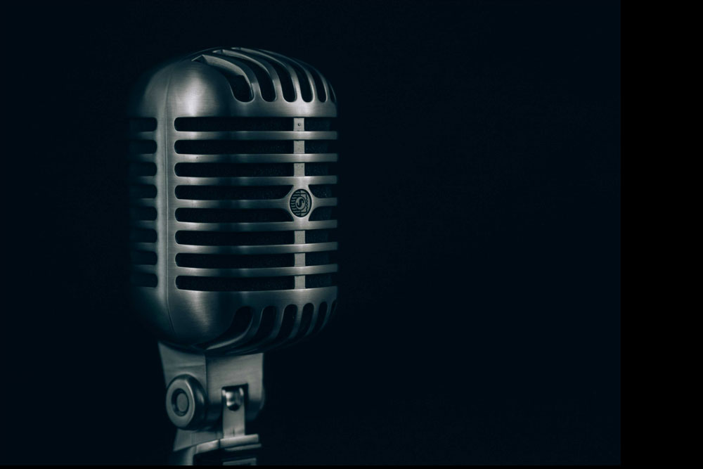 An old-style mic on a black background