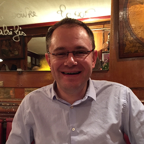 A photograph of Professor Frederic Blanc. Frederic is a man with short dark hair who is wearing glasses.