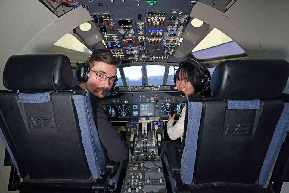 Two students in Flight Simulator