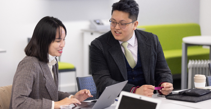 Senior executives interacting during a university lecture.