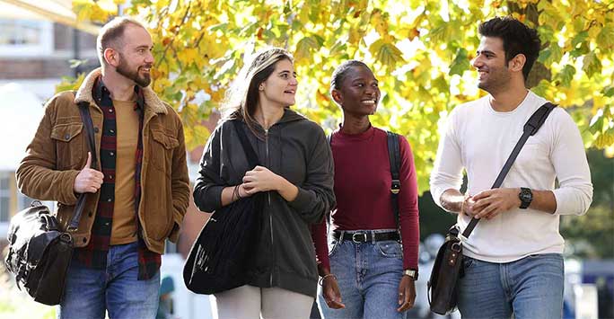 Master's students walking on campus
