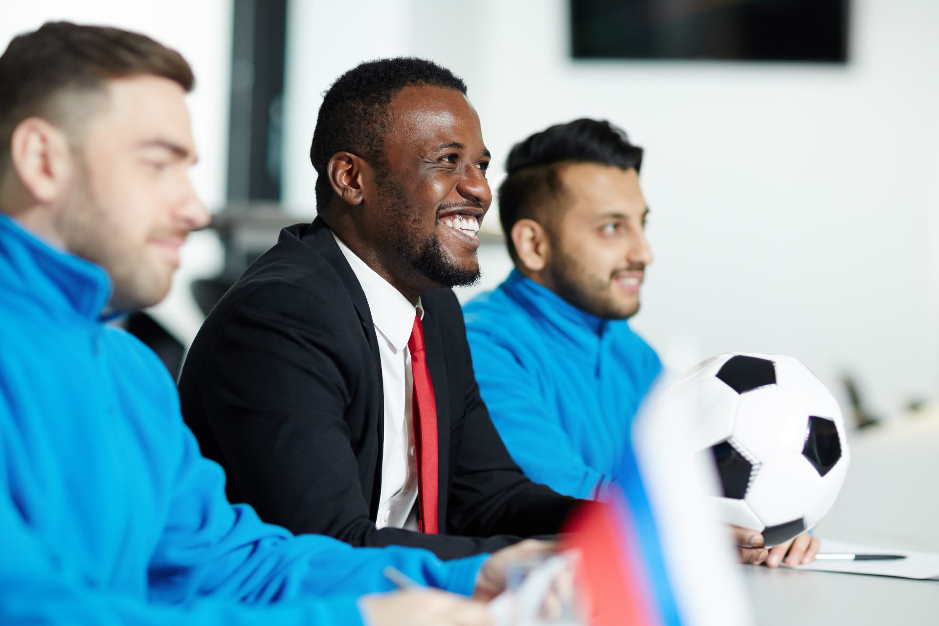 Black sports manager gives press conference alongside two players