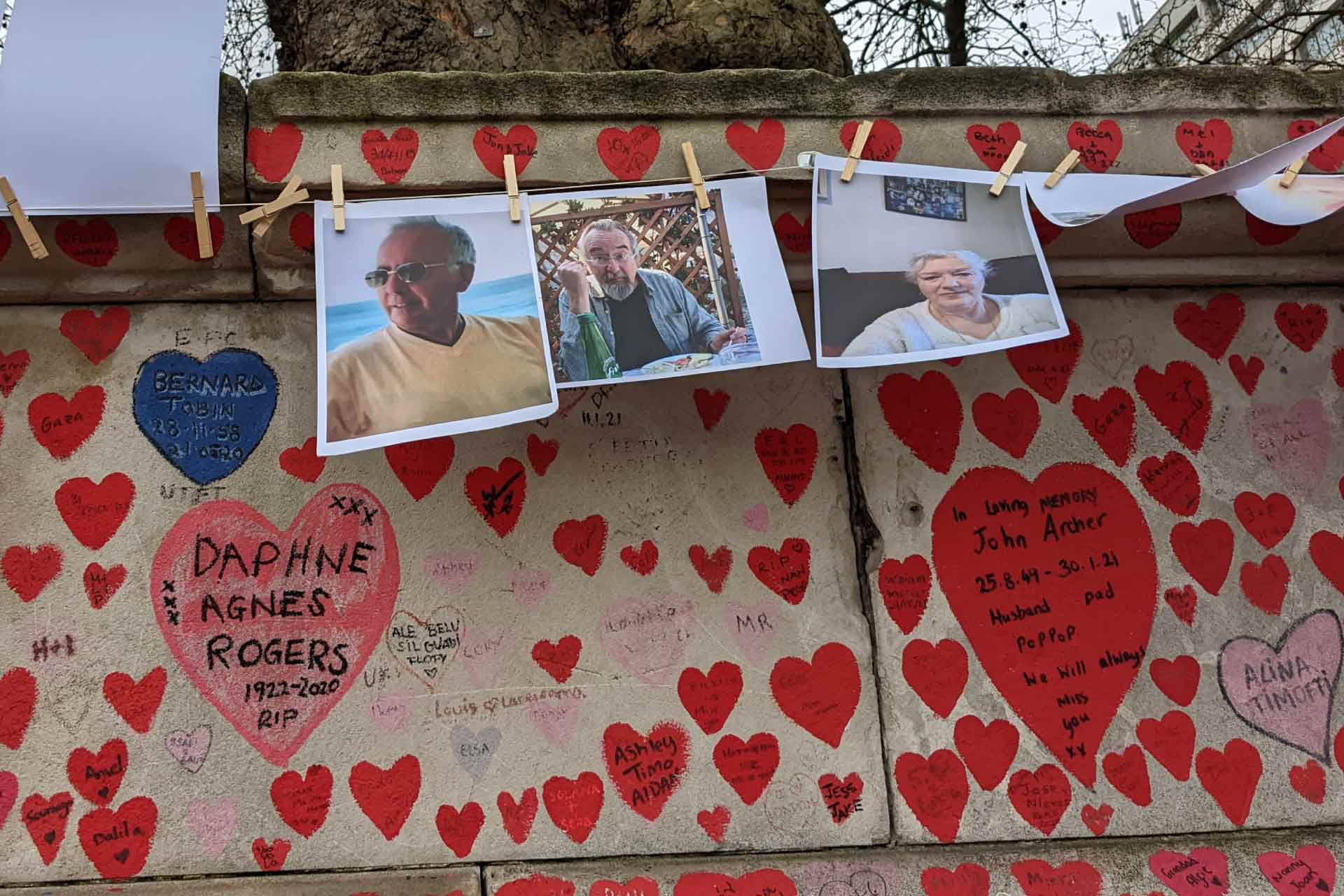 COVID-19 memorial wall with images and love messages for victims of the pandemic
