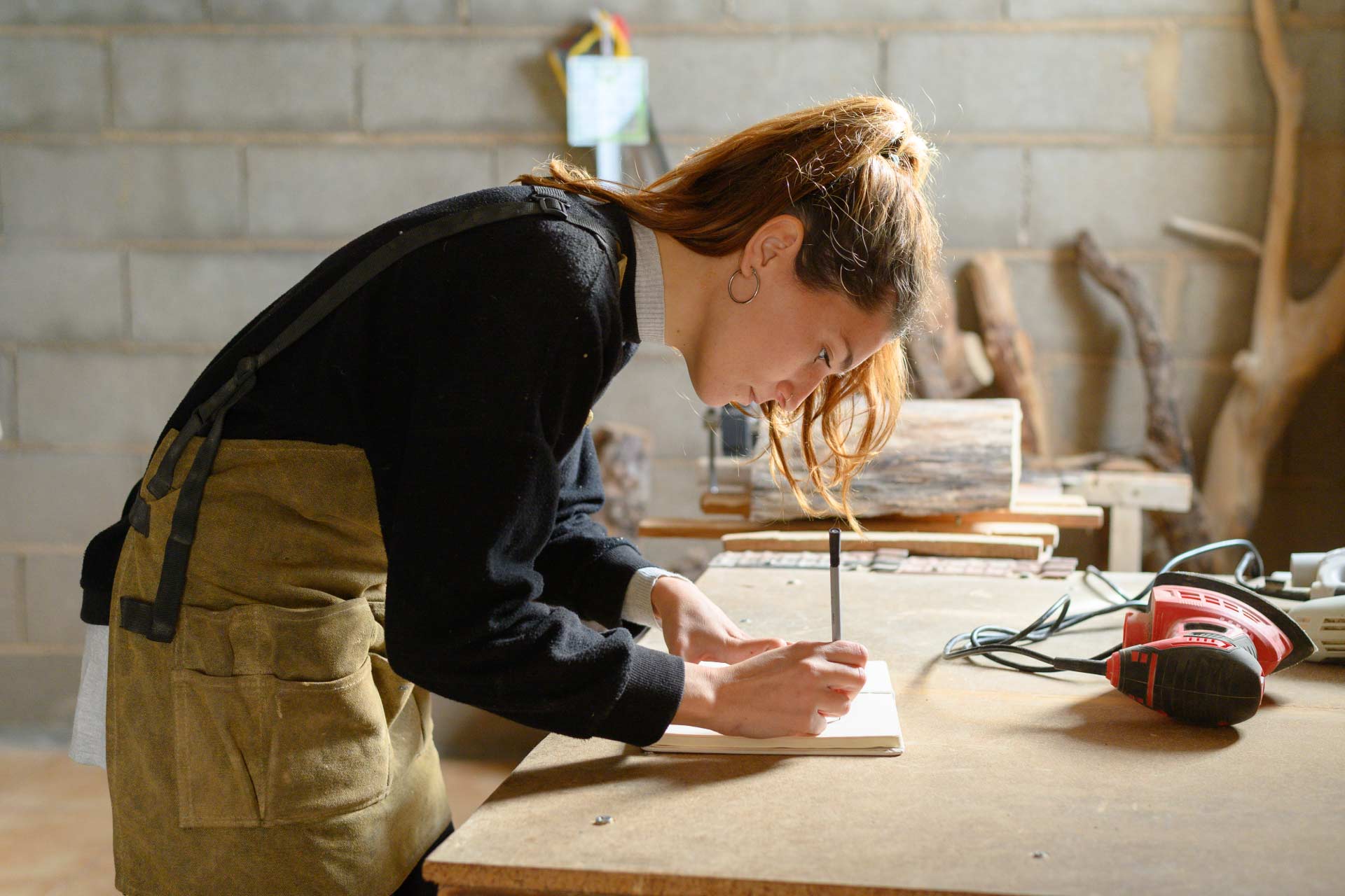 Young craftswoman working in a workshop