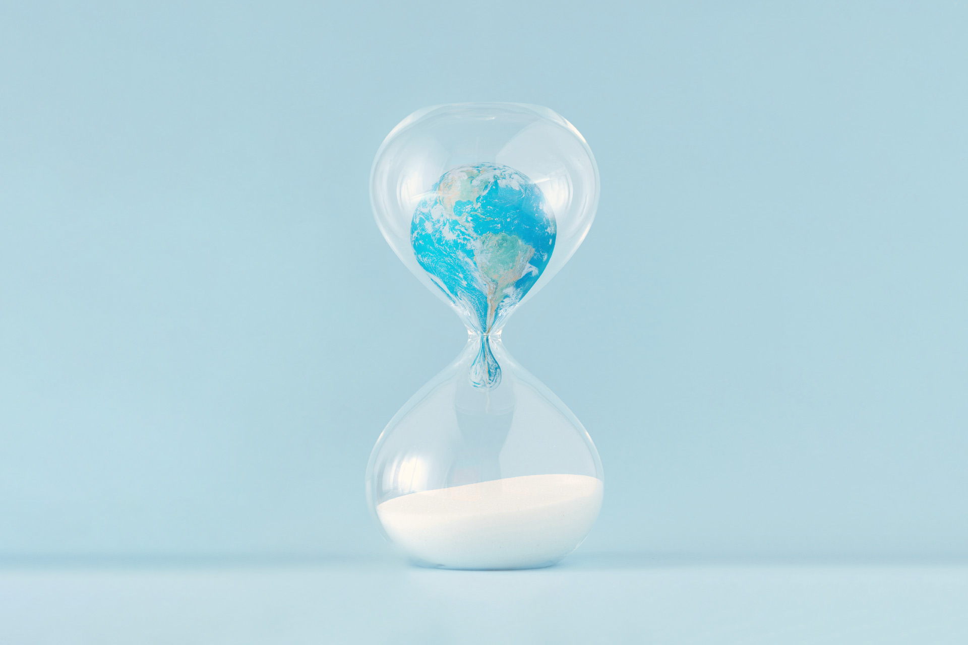 Concept image - Hourglass with planet Earth inside