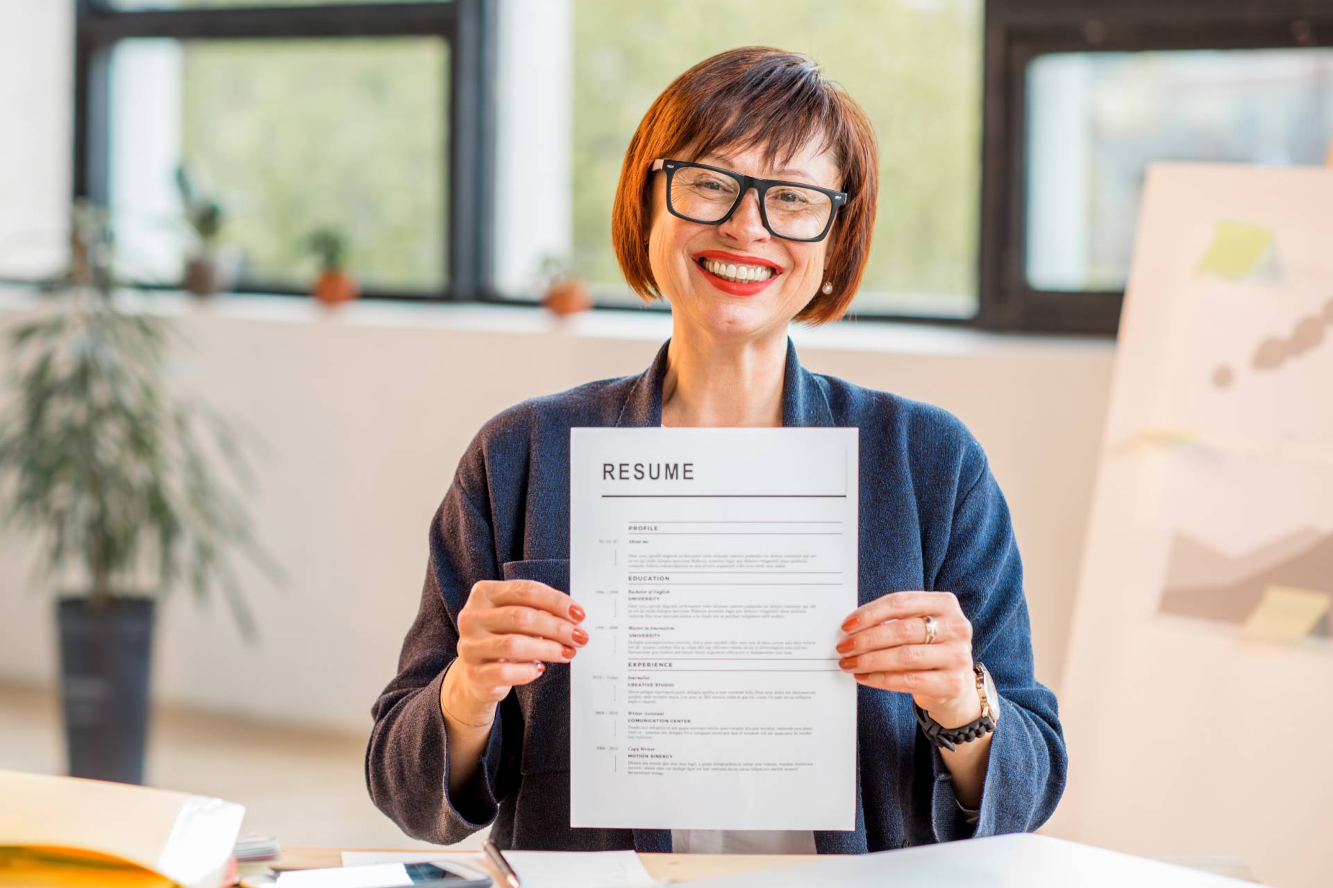 Mature woman holding CV