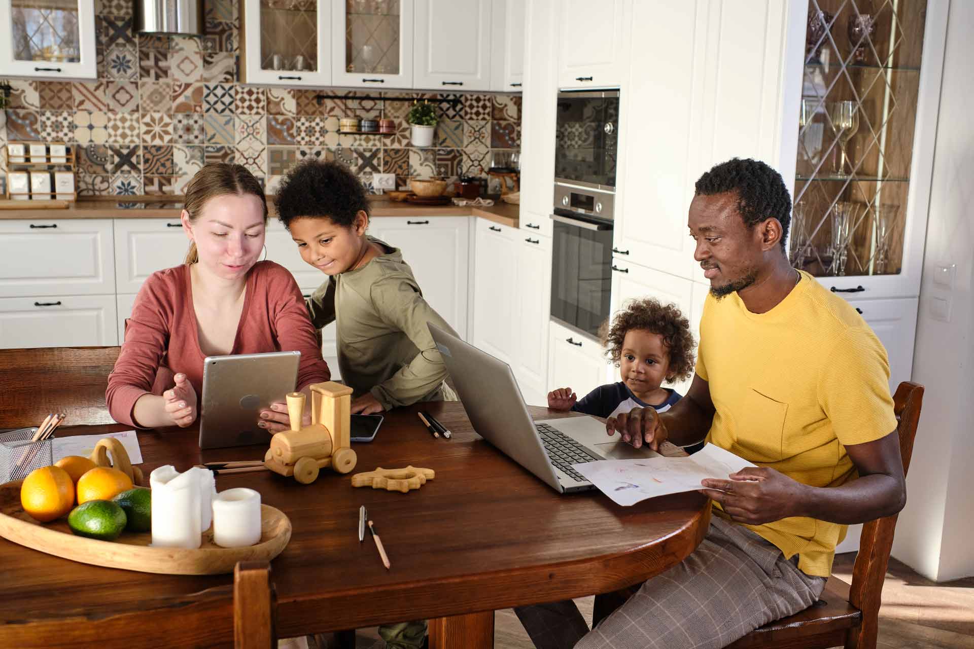 Parents work from home while looking after their children