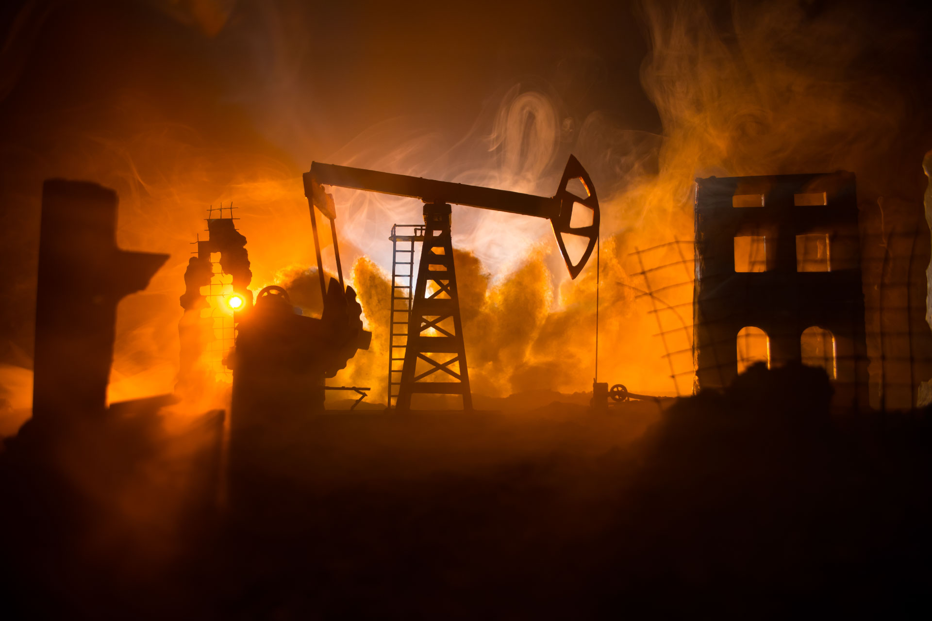 Concept image - Petrol refinery with building on fire around it