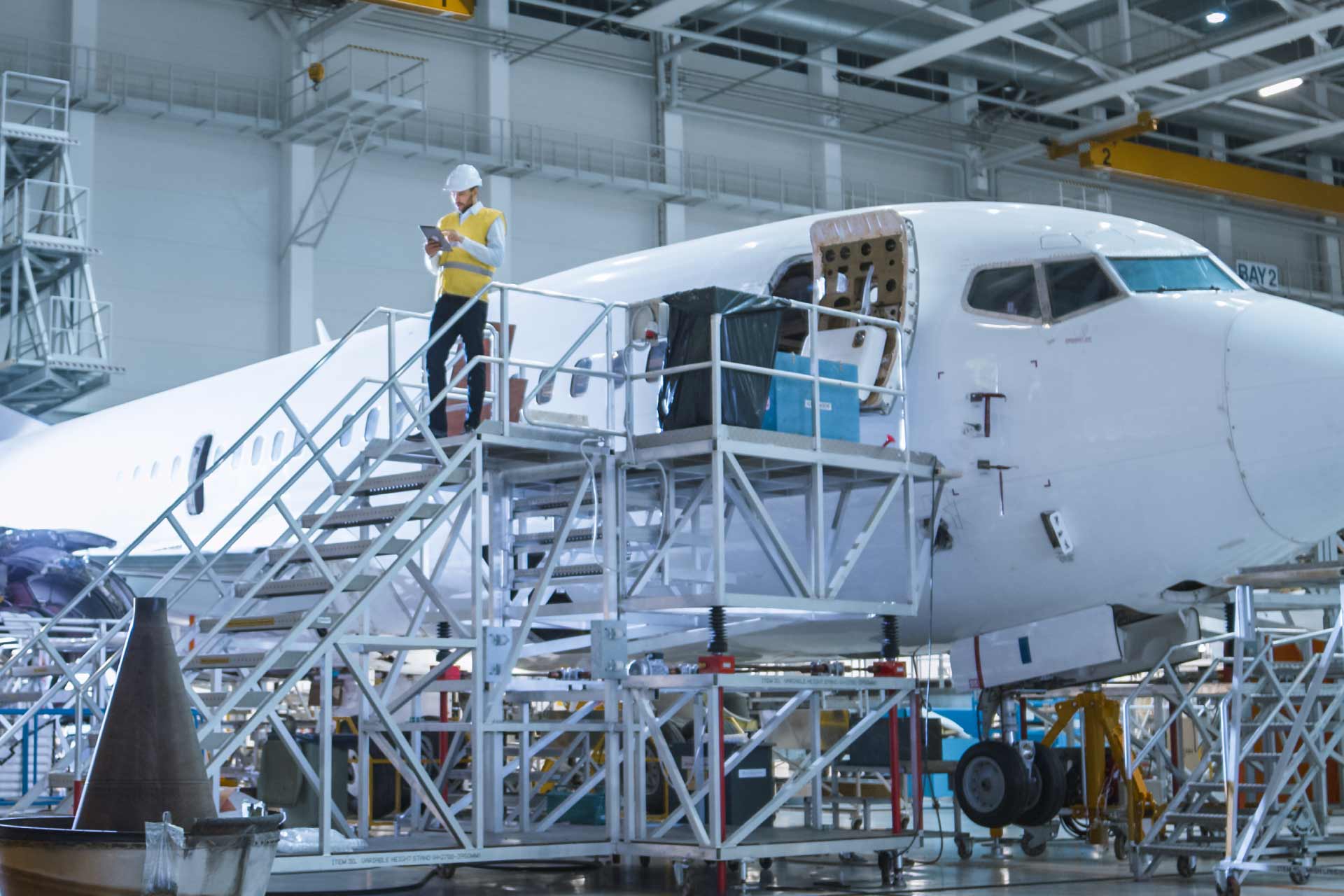 Engineer working in plane production plant