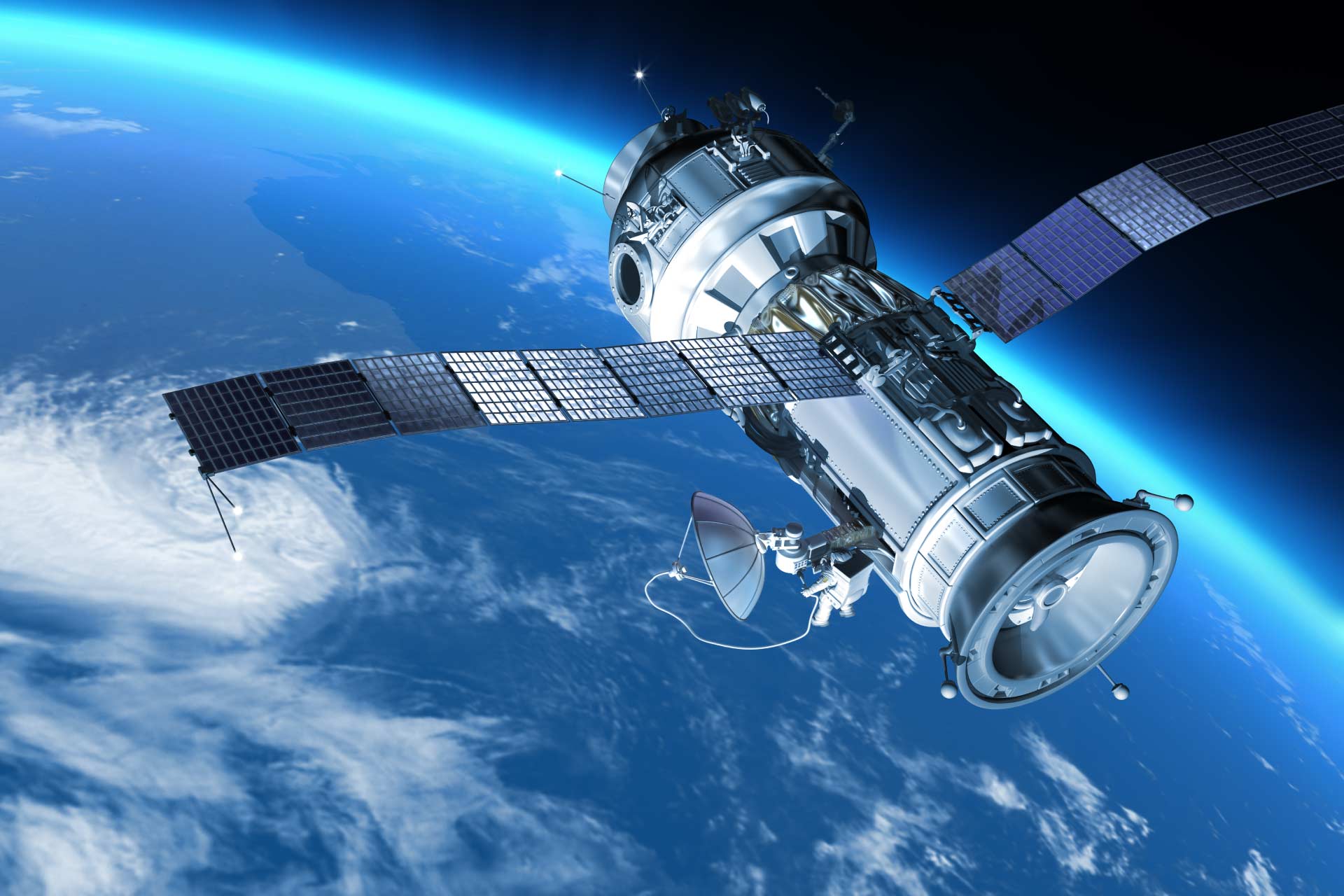 Image of satellite in space travelling over the Earth