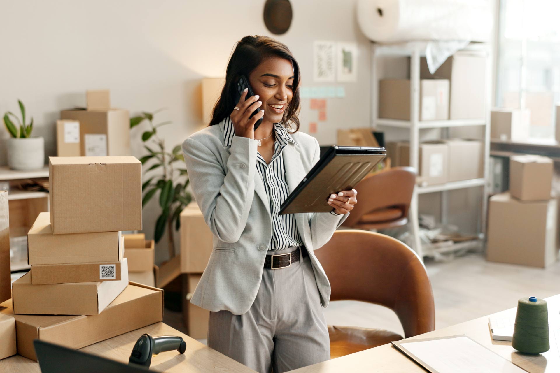 Young female entrepreneur answering a business call