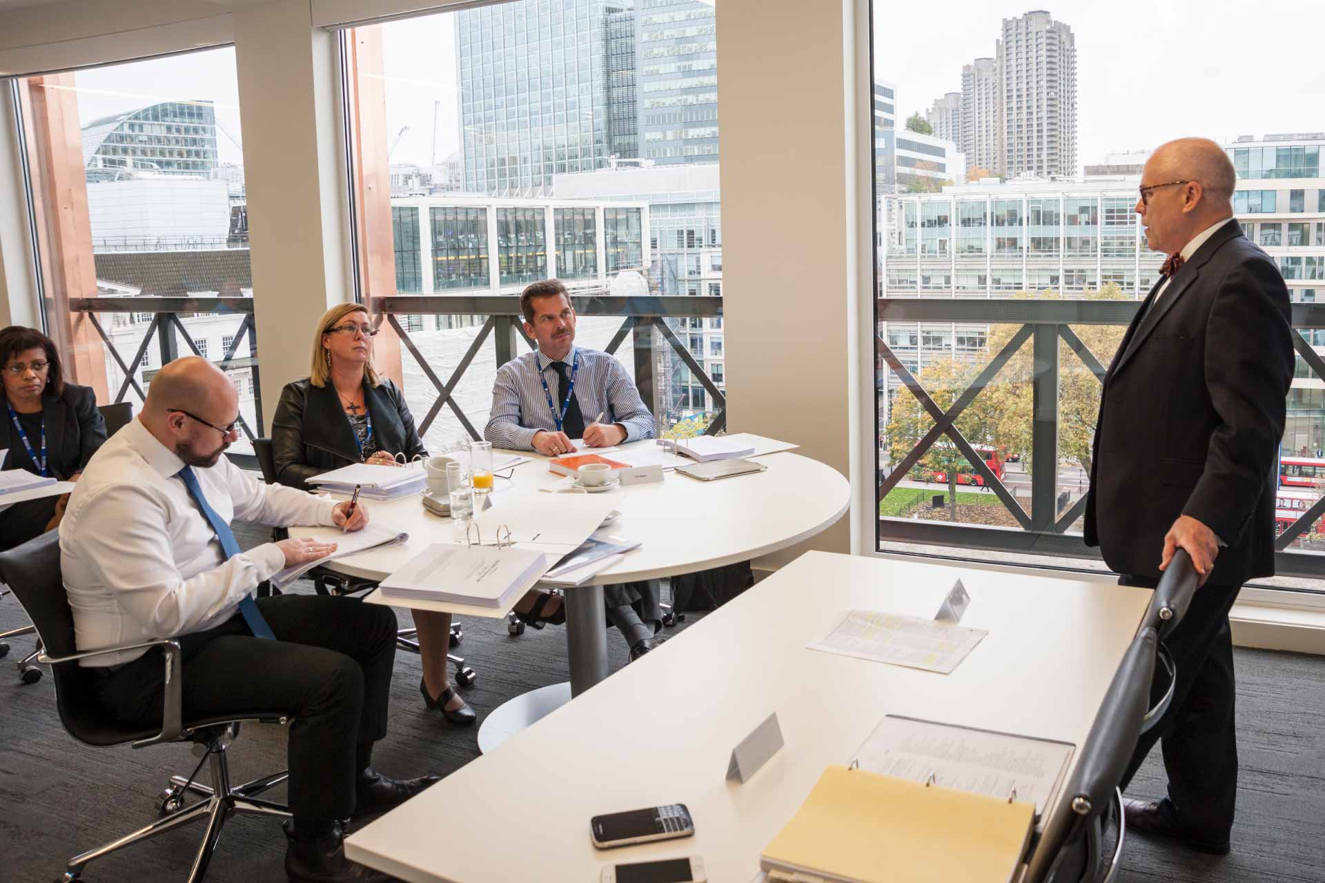 Group of mature business executive students attending a class.