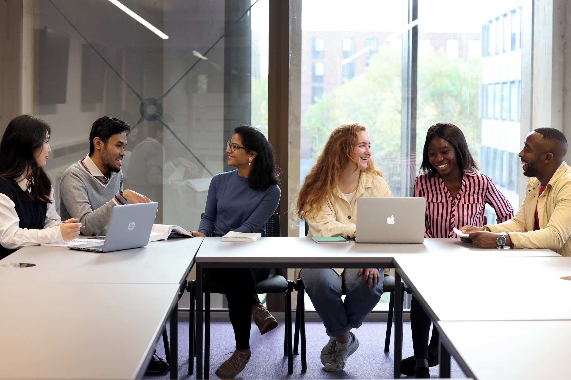 Group of students chatting in a classroom