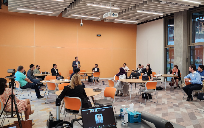 Image of delegates listening to keynote speaker at Sustainable Financial Innovation Conference