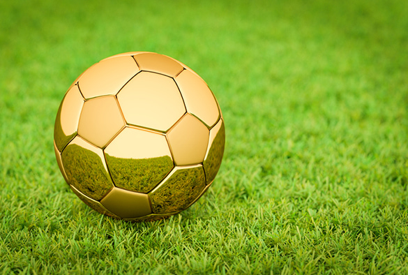 Golden Football on the grass