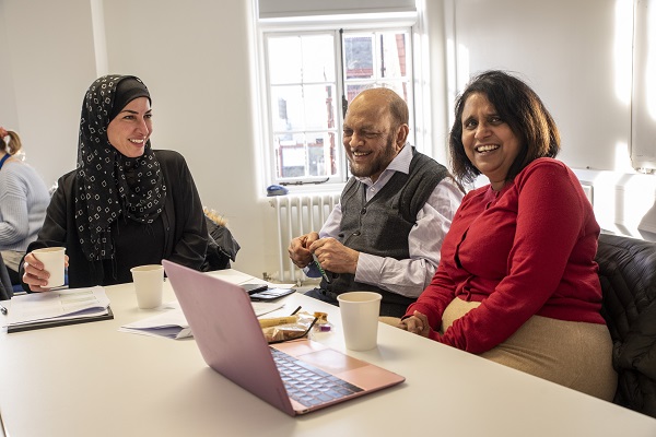 Three people working together during a workshop